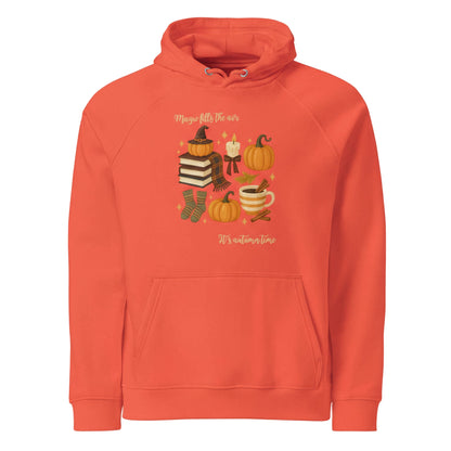Orange Magic Fills the Air Hoodie with autumn pumpkins, books, candle, and cozy design