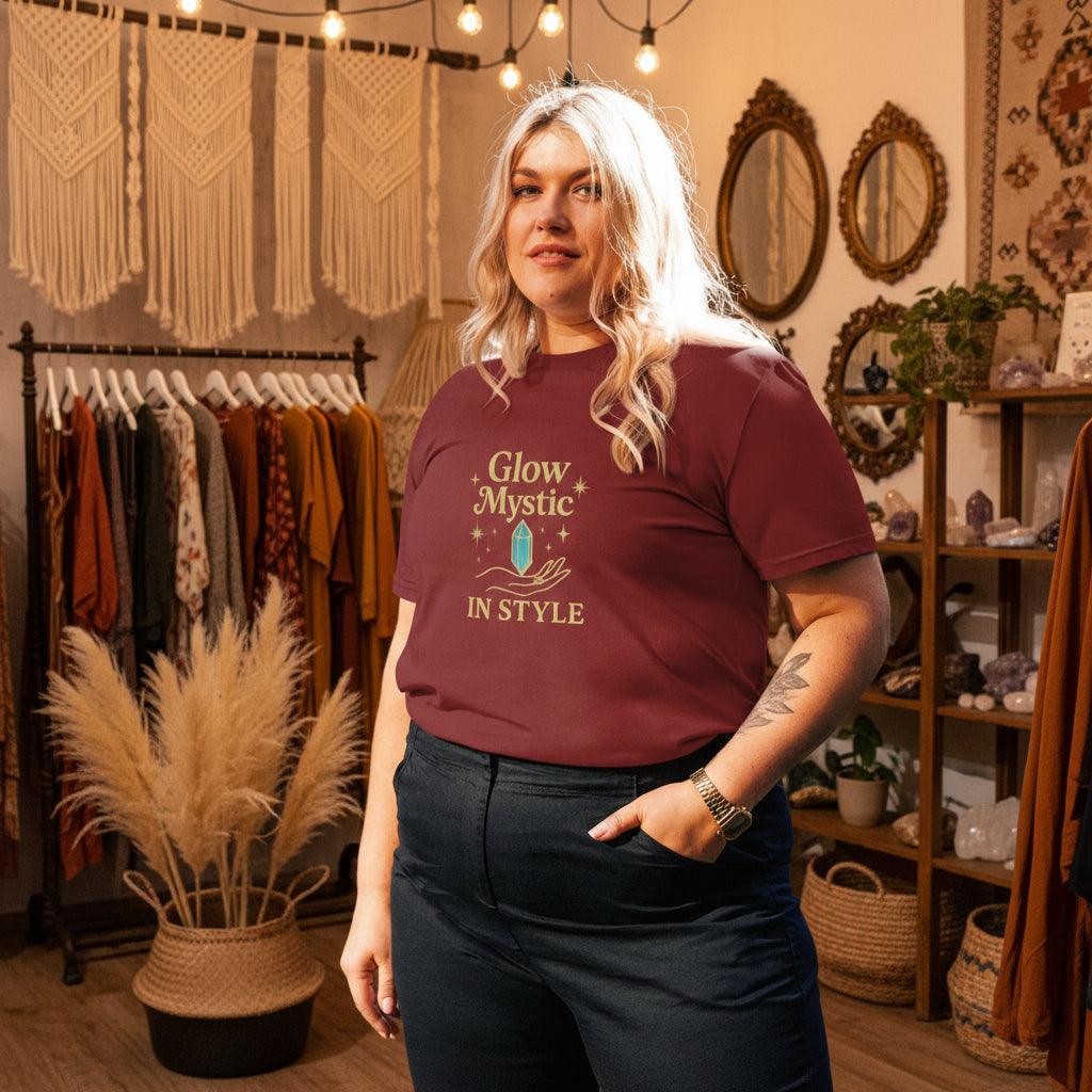 Woman wearing maroon Glow Mystic in Style organic cotton t-shirt with gold logo in cozy boho room