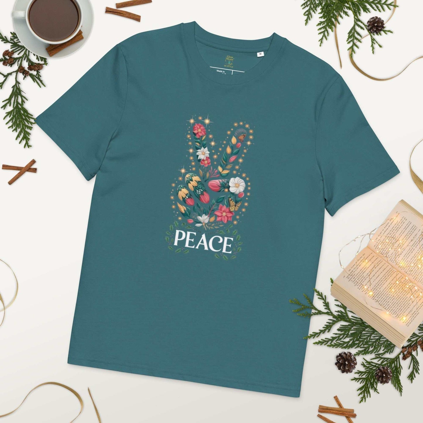 Unisex Organic Cotton T-shirt with floral peace sign design on teal fabric, eco-friendly and soft