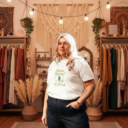 Woman wearing white Glow Mystic in Style organic cotton t-shirt with gold logo in stylish boho room