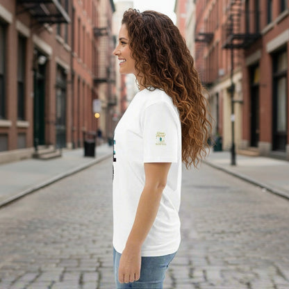 I'm a Vibe Unisex Organic Cotton T-Shirt worn by a woman in white, side view on urban street background