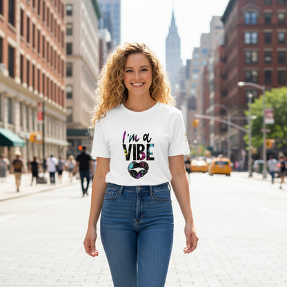 Woman wearing a white I'm a Vibe Unisex Organic Cotton T-Shirt with colorful text print outdoors