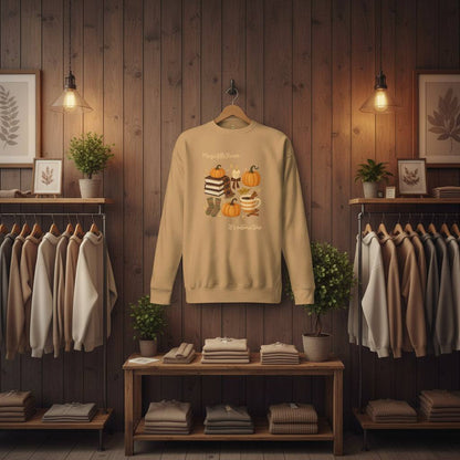 Autumn Magic Classic Sweatshirt beige with fall-themed graphic of pumpkins and cozy items in rustic wooden store setting
