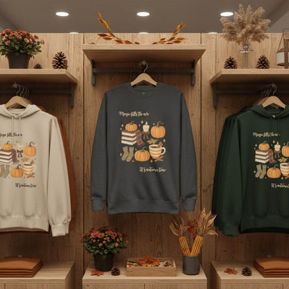 Autumn Magic Classic Sweatshirt with pumpkins and cozy fall design in charcoal, cream, and green colors on wooden display shelves