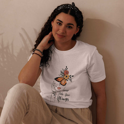Woman wearing white Butterfly Graphic Organic Cotton T Shirt with nature-inspired butterfly design sitting against beige background