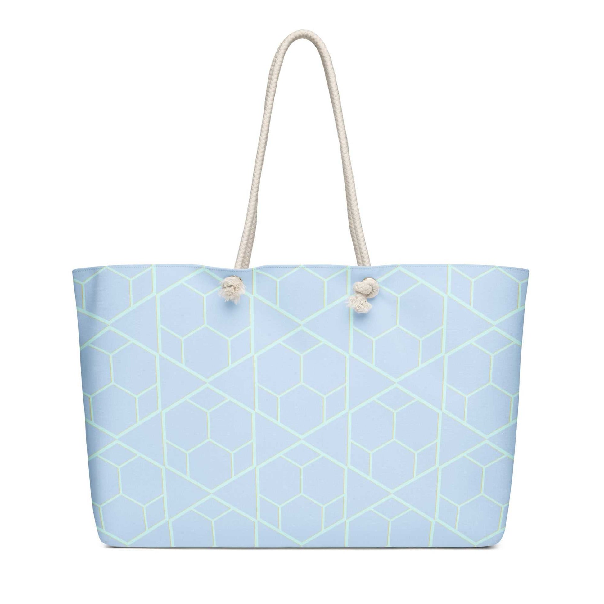 oversized weekender bag with light blue geometric pattern and cream rope handles for travel and style