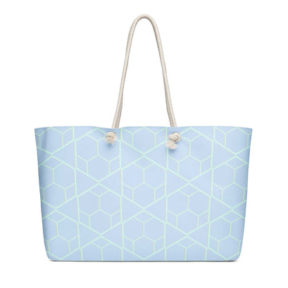 oversized weekender bag with light blue geometric pattern and cream rope handles for travel and style