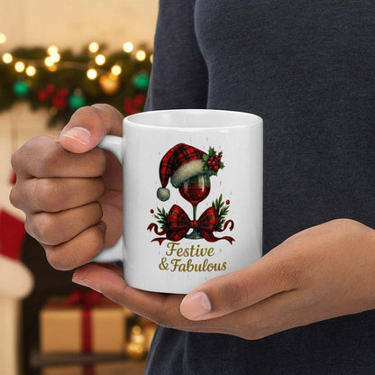 Festive & Fabulous Christmas mug with wine glass, Santa hat, and holiday decorations on white ceramic cup