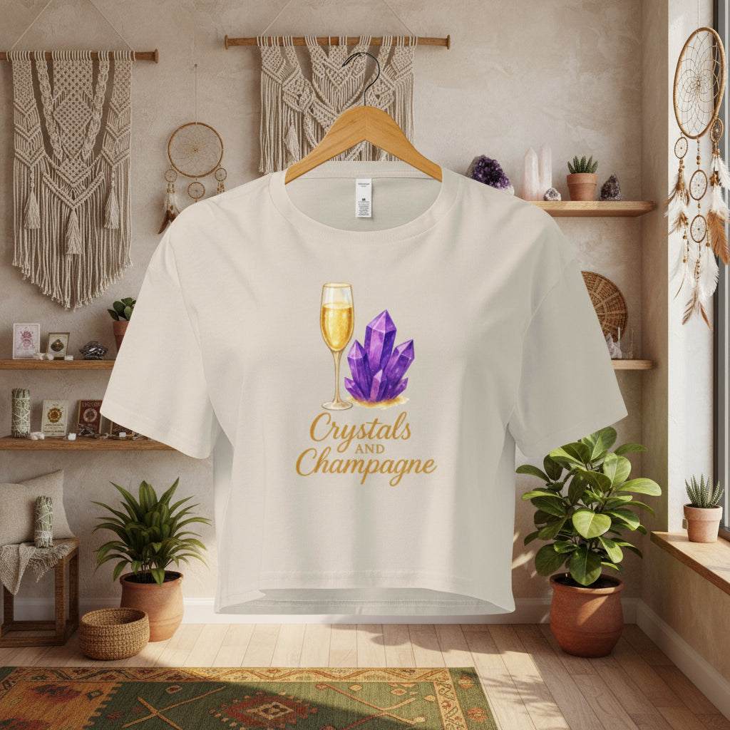 Crystals and Champagne Women's Crop T-Shirt with champagne glass and purple crystals design in cozy boho room setting