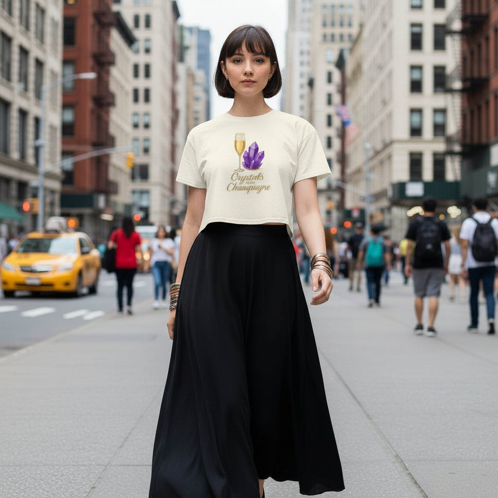 Woman wearing Crystals and Champagne Women's Crop T-Shirt with champagne glass and purple crystals print in urban setting